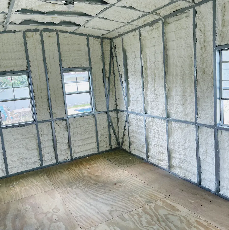 Closed-cell spray foam insulation applied to wall cavities in a residential project in Leitchfield